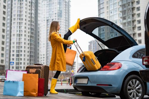 Flexible,Woman,Holding,Split,And,Taking,Out,Bags,From,The
